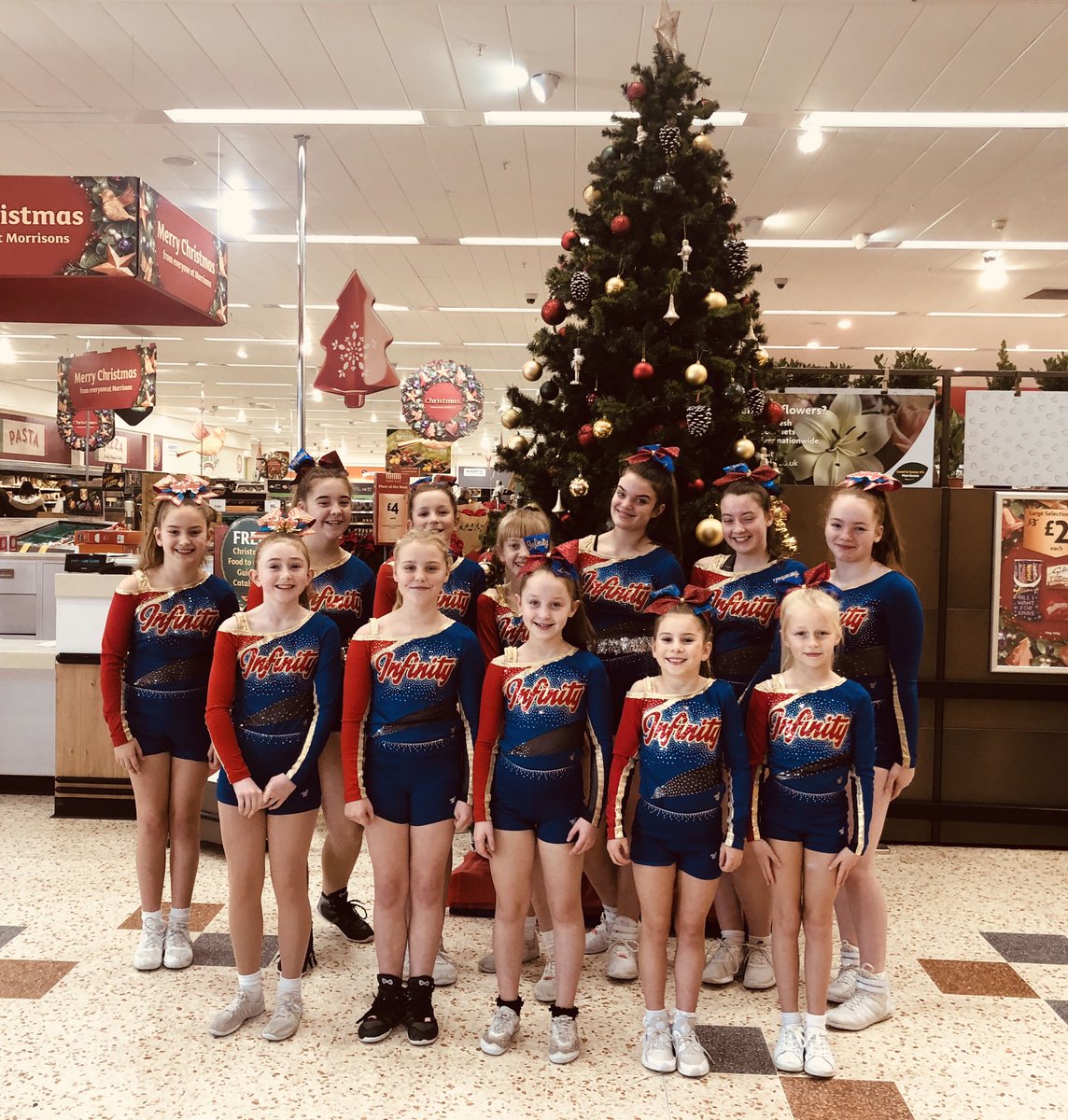 CheerTravel's tweet image. We are @Morrisons Leyland doing another bag pack. The girls look fab in their @NISLimited sponsored bows 🎀🎄