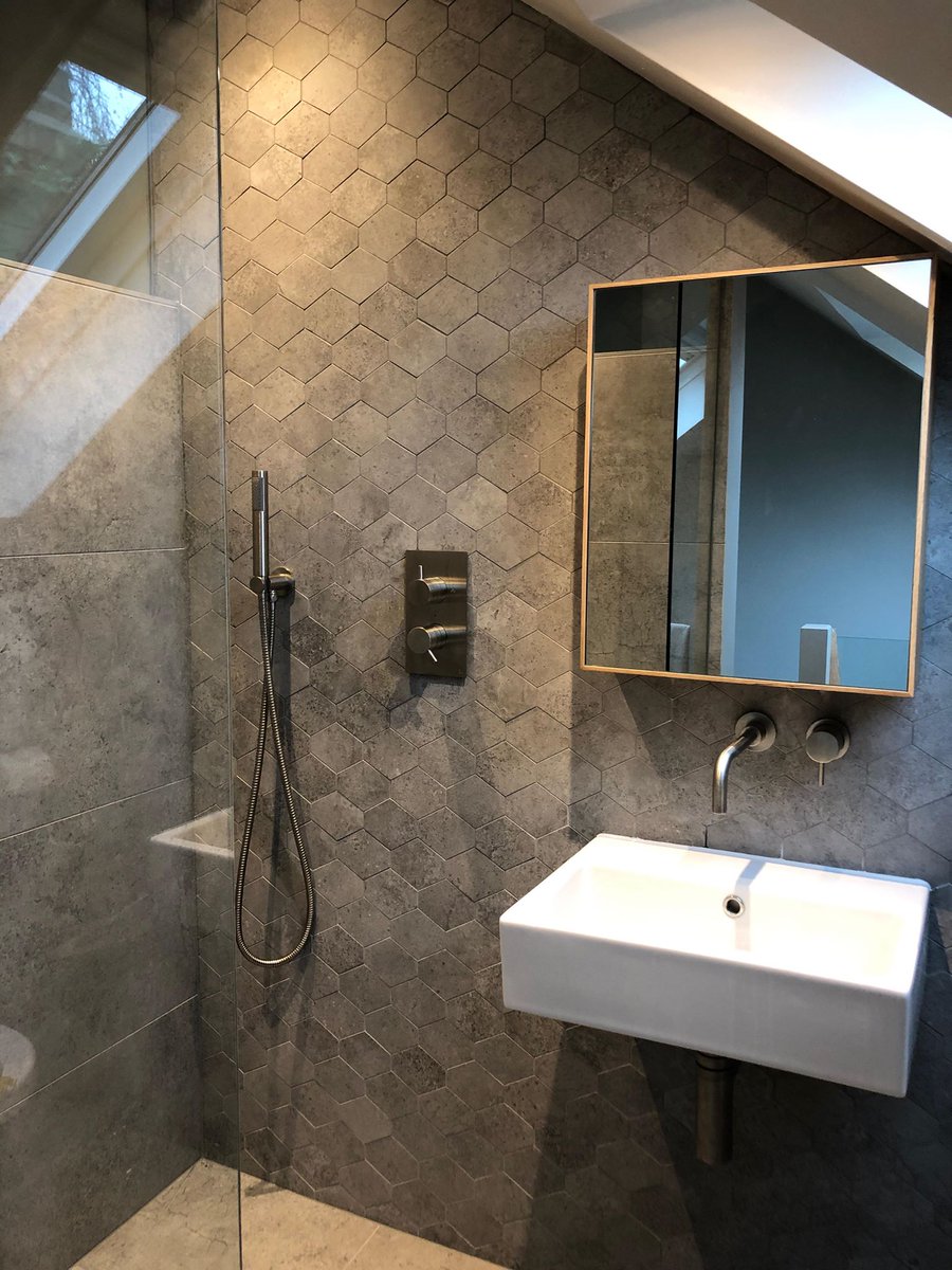 nikimauthner's tweet photo. When upsizing isn’t an option it is better to invest in the home you have. This recent client project optimised existing #loftspace to include a #wetroom with floor to ceiling concrete finish tiles @mandarinstone 
Open plan showering with plenty of room to swing a cat!
#Interiors https://t.co/j6qtKv7xHF