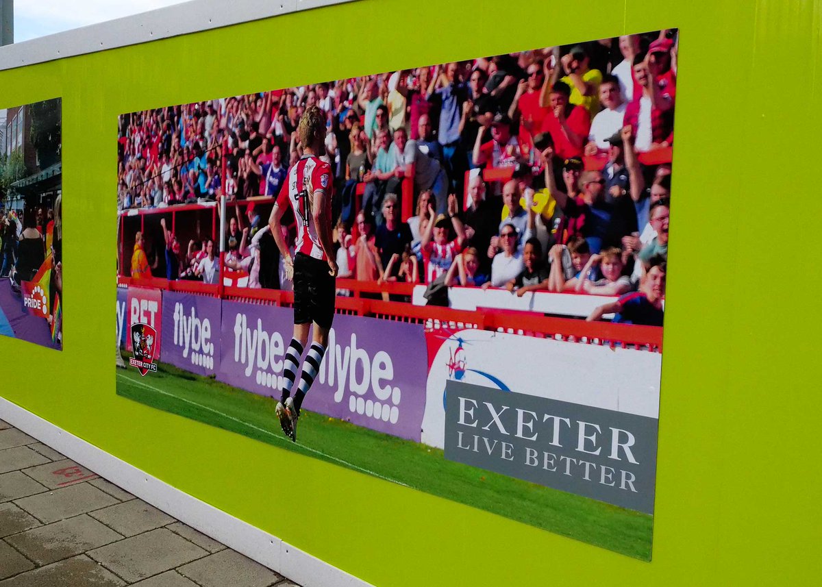 ExeterCouncil's tweet photo. More amazing images going up around the old bus station site today. All showing how amazing our city is. Great to see @OfficialECFC, @QuayClimbing and @StSidwells looking great. #LiveBetterExeter #LoveExeter https://t.co/TLRYE7mbXI