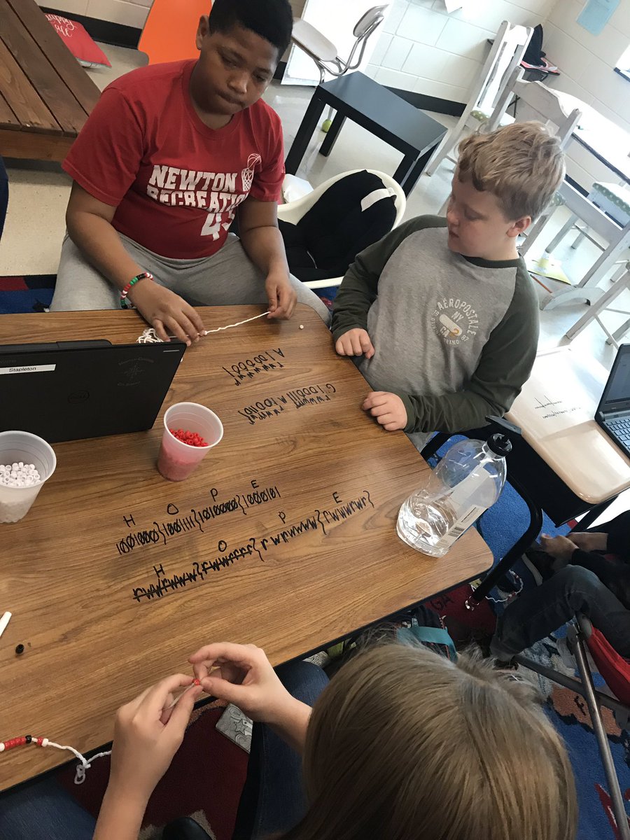 edpuzzlesarah's tweet photo. We learned about #BinaryAlphabet today for part of our #hourofcode2018 and made bracelets & ornaments to spell our initials or something for mom or dad. Then we wrapped up with @codeorg time. #snewton #holyengagement 🤩 https://t.co/ONZs6UnoxH