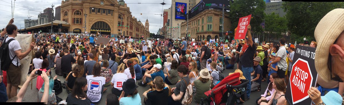 takvera's tweet image. #climatejustice #Melbourne #narm #stopadani sitting down in front of Flinders Street Station to hear youth speakers and pacific island warriors. The crowd parts to allow 2 fire engines through with cheers to the firies, and closes down the intersection again #COP24