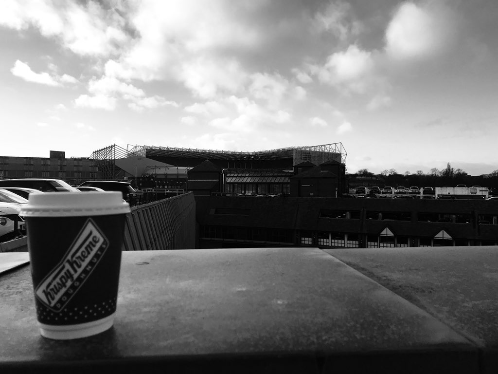 RidePhotography's tweet photo. So this mornings Tweet got us thinking 🤔🤔 Coffee Break Locations!!!  @krispykremeUK coffee whilst in Newcastle, not many views from a car park like @intueldonsquare car park view of @NUFC #StJamesPark. Image had to be in Black and White of course #magpies #toonarmy https://t.co/wmnjCRzMVK