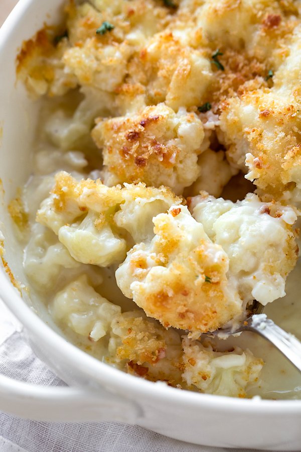 This creamy and delicious Cauliflower Casserole with a crisp panko and parmesan topping is a scrumptious way to turn cauliflower into a cheesy side dish! thecozyapron.com/cauliflower-ca…