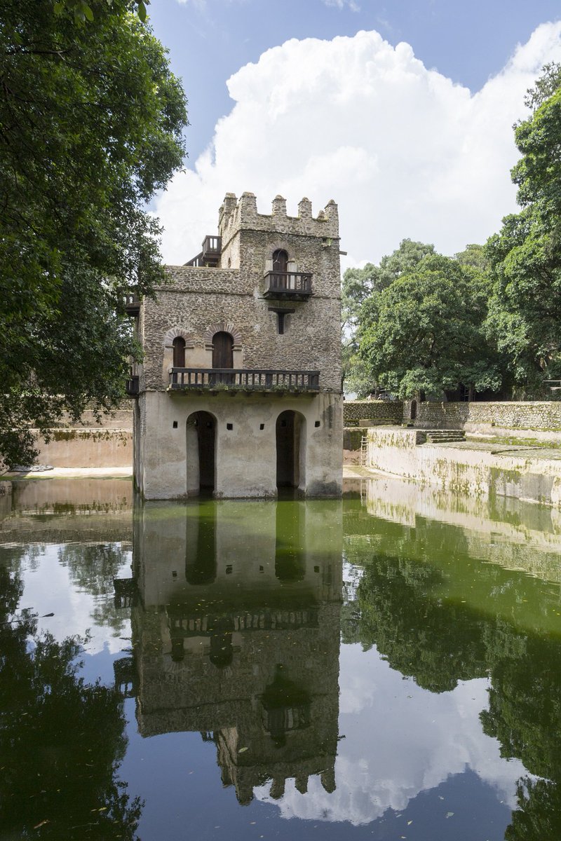 TravelEthiopia2's tweet photo. Fasiladas Bath, which  has been attributed to both Fasiladas and Iyasu I, is a large  rectangular pool that is overlooked by a charming building, thought by  some to be a vacation home. Travel to Ethiopia this December to see thousands of people splashing into the pool.  #travel https://t.co/YIILL51QwN