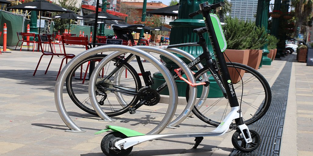 DecemberNights's tweet image. REMINDER! You can park your scooter or bike ride in the new designated areas near the Laurel Street Bridge, Fig Tree and Federal Lawn. You may even get some swag from @birdride! #DecemberNights2018