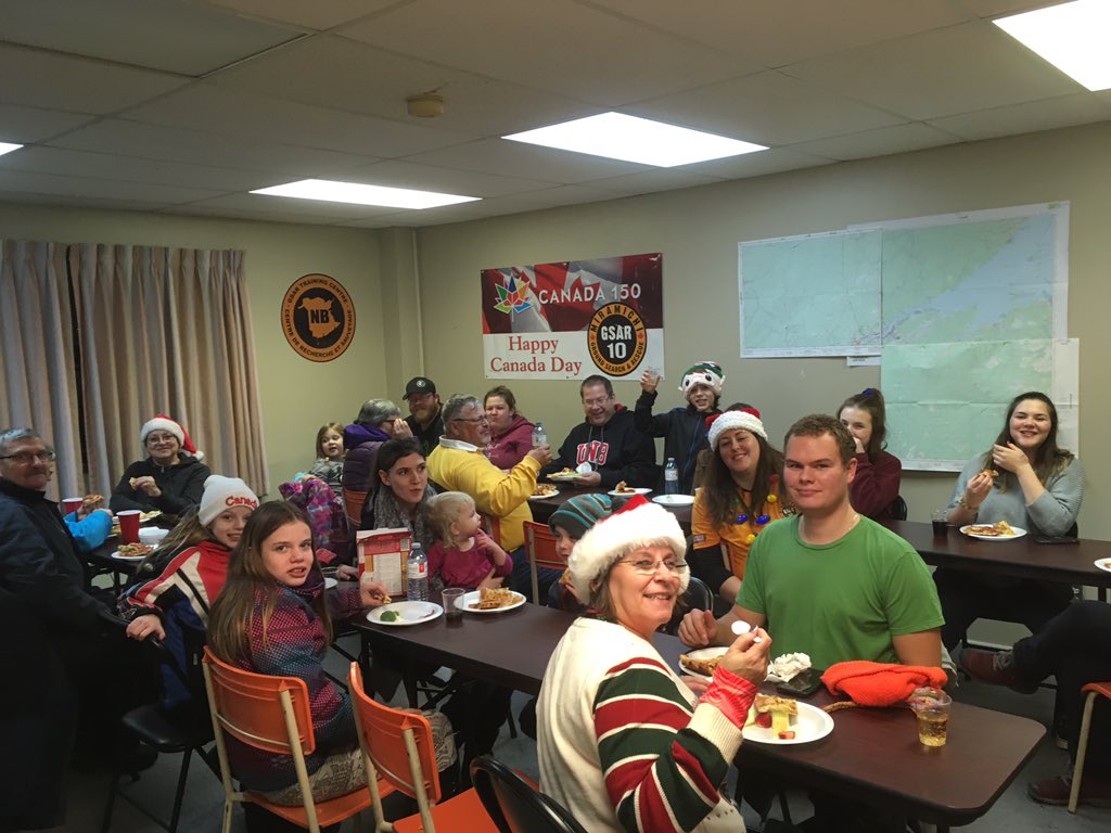 MiramichiGSAR's tweet photo. Members of the #MGSAR team (and some young future members) had a great time at last night’s Parade of Lights in #Miramichi! 

Afterwards our team continued the fun with a Christmas party at our base (eating pizza and decorating gingerbread are always a great combo!).
#mgsar https://t.co/GUzQCf7s1Q