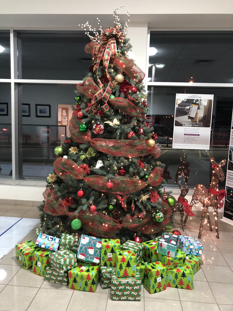 RoyNicholsChev's tweet photo. It’s beginning to look a lot like.... 
(BTW - those presents under the tree are for customers!!! Buy a car, pick a present!) Open up to $1,500.00!!! #12DaysOfPresents #RoyNicholsMotors https://t.co/EjUXSaazsg