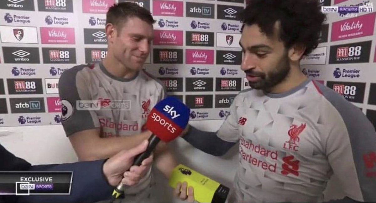 Salah, junto a Milner.