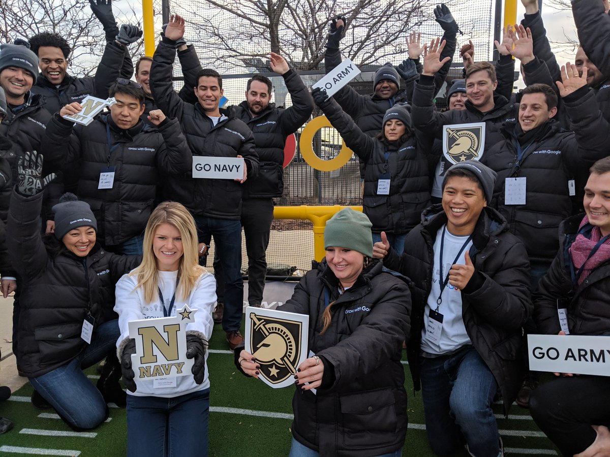 Googlers in front of the Google goal post sign at the Army Navy game.