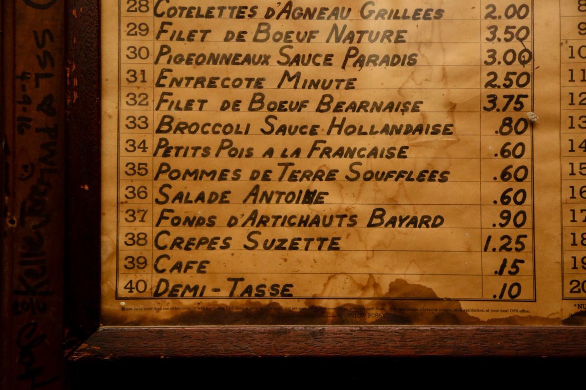 AntoinesNOLA's tweet photo. How cool this old menu hanging in our #WineCellar?! #AntoinesNOLA #OldSchool #OldMenu #HistoricWalls https://t.co/scfqe6oat5
