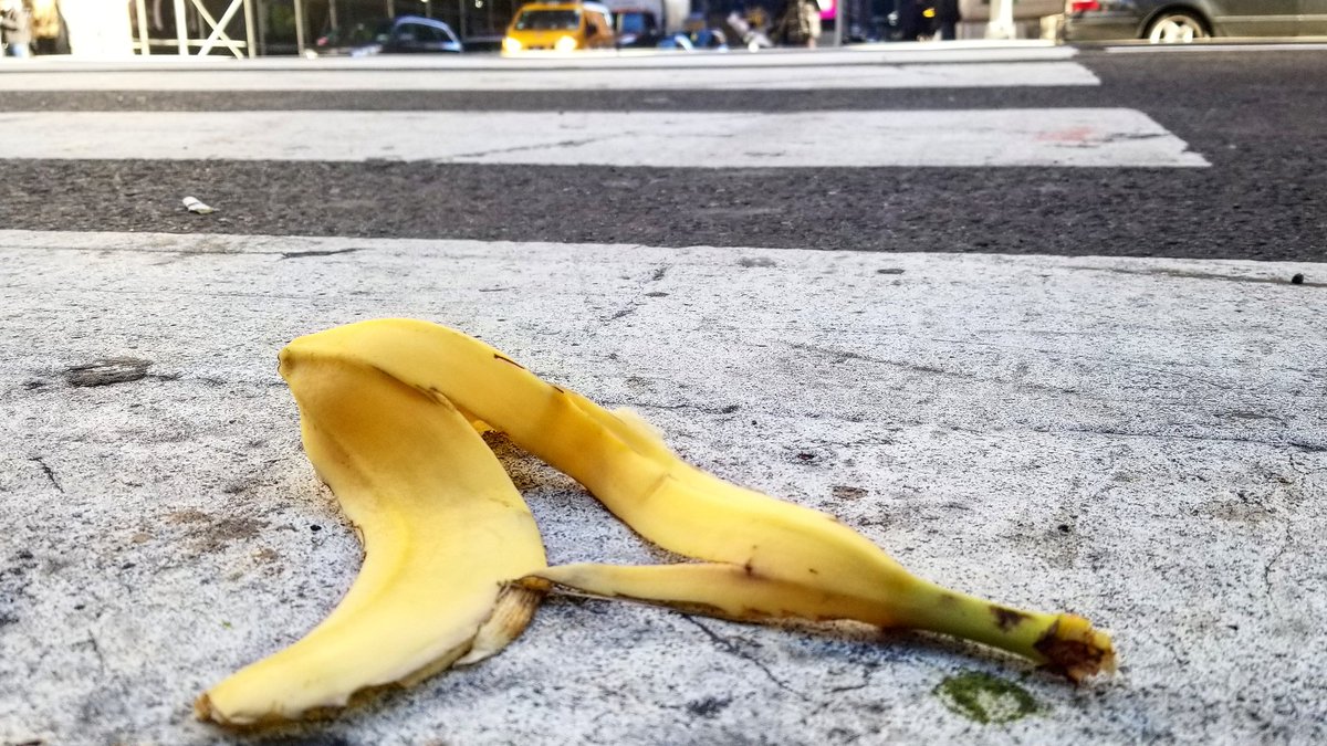 theMEATofit's tweet photo. A crosswalk during the walk signal with a banana peel. 👣 #nothingissafe ☠ #bananapeel #accidentalhumor #citylife #NYC #street #slapstick #slippery #wearealldoomed https://t.co/zABbQhDuwK