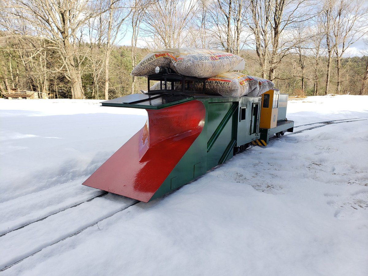 The Mill Brook Railroad winter routine: plow the drifts out, haul heating fuel back.