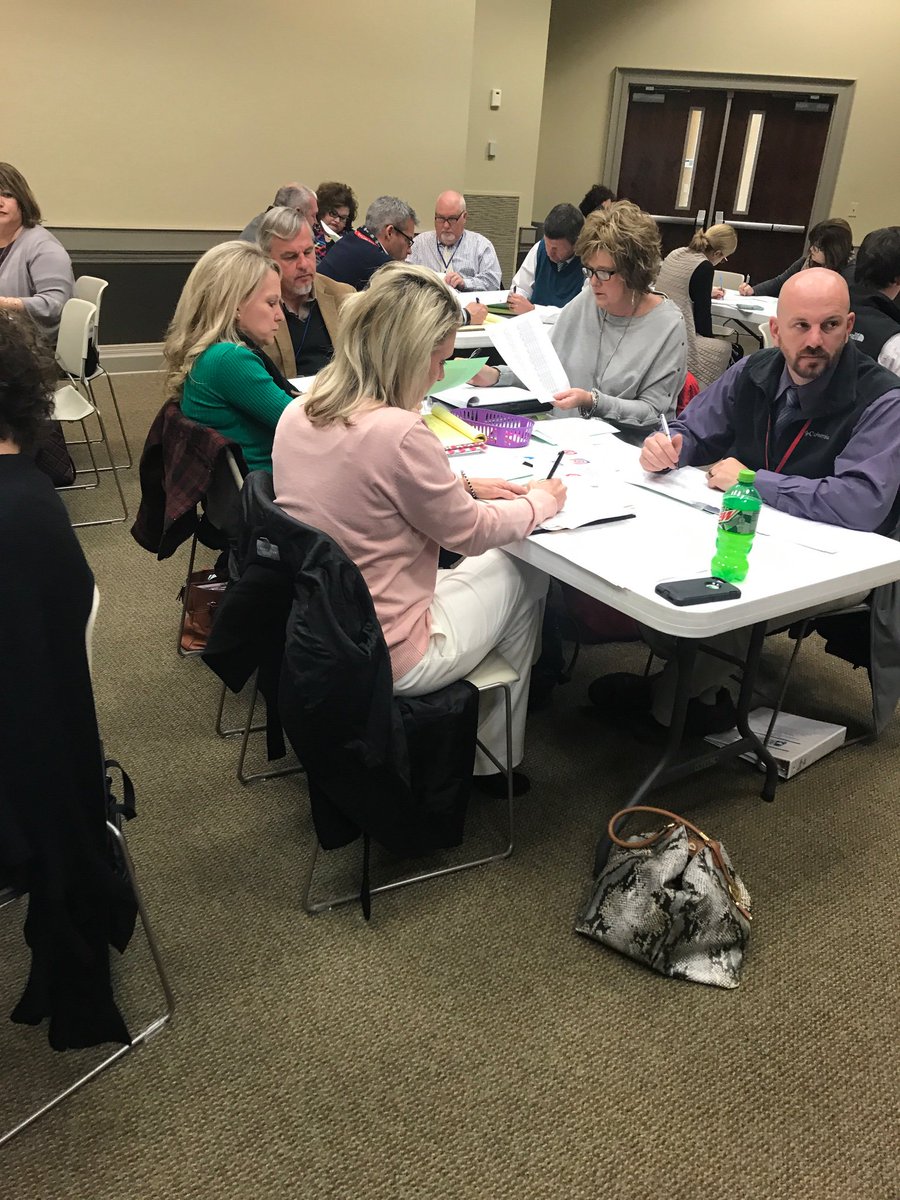 District Administrators and K3 Administrators from GL 1, examining Diagnostic Test Reports.