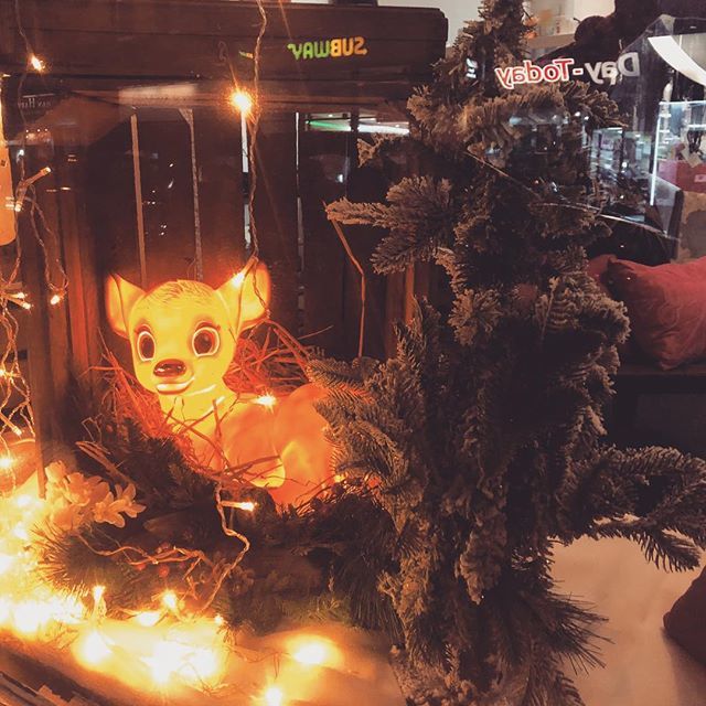 shopofinterest's tweet photo. We turned the lights on! Bright lights and a Bambi manger. Christmas window at The Shop of Interest! https://t.co/hr5sLgnJ48 https://t.co/fLgHuACE8W