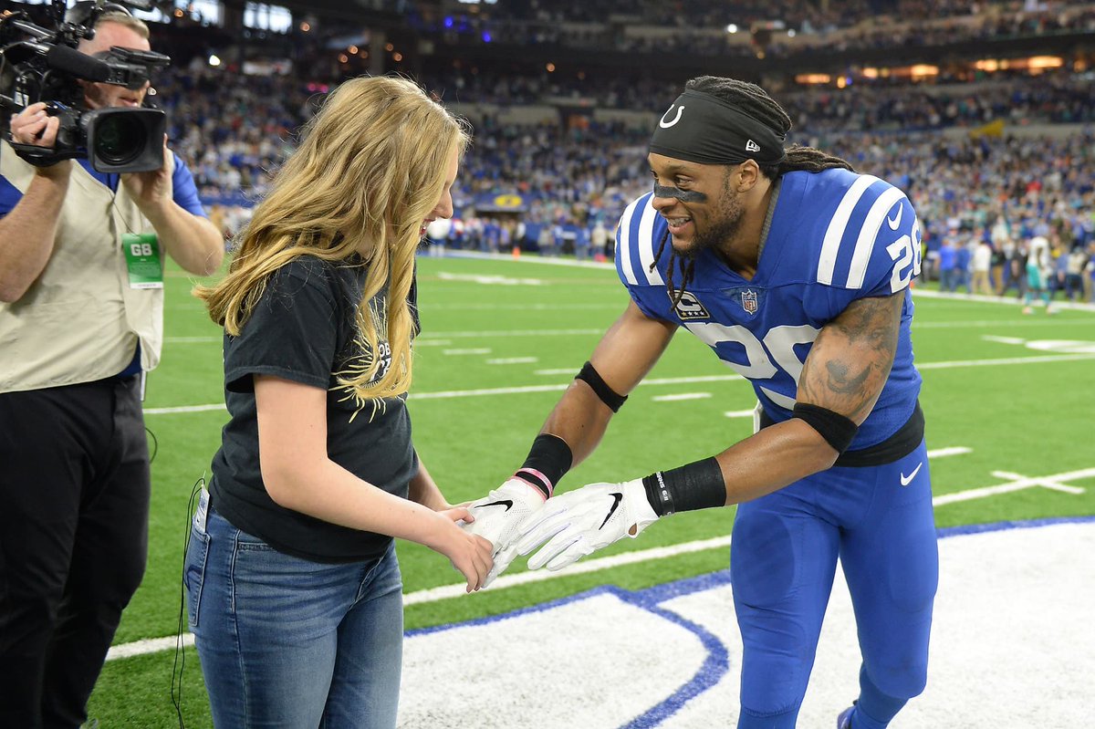 Love this pic of my niece Ella meeting @cgeathers26 as honorary captain at the coin toss.  #EllaStrong #GoColts
