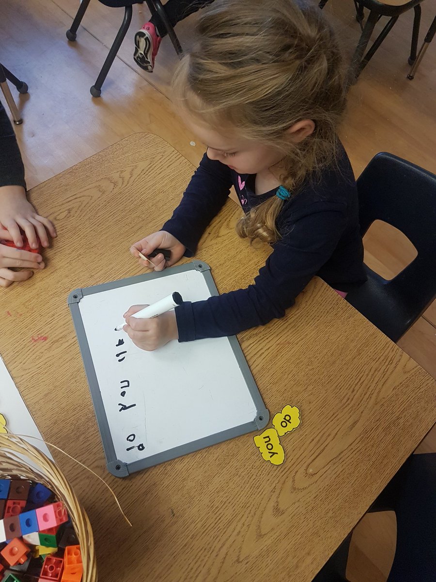 AlainaStandring's tweet photo. Evelyn expressed interest in writing a #QOTD for the class, so to prepare, she found the popcorn sight words she needed to write her question. Stay tuned tomorrow! #Kindergarten #literacy #authenicwriting https://t.co/43bC75hrNR