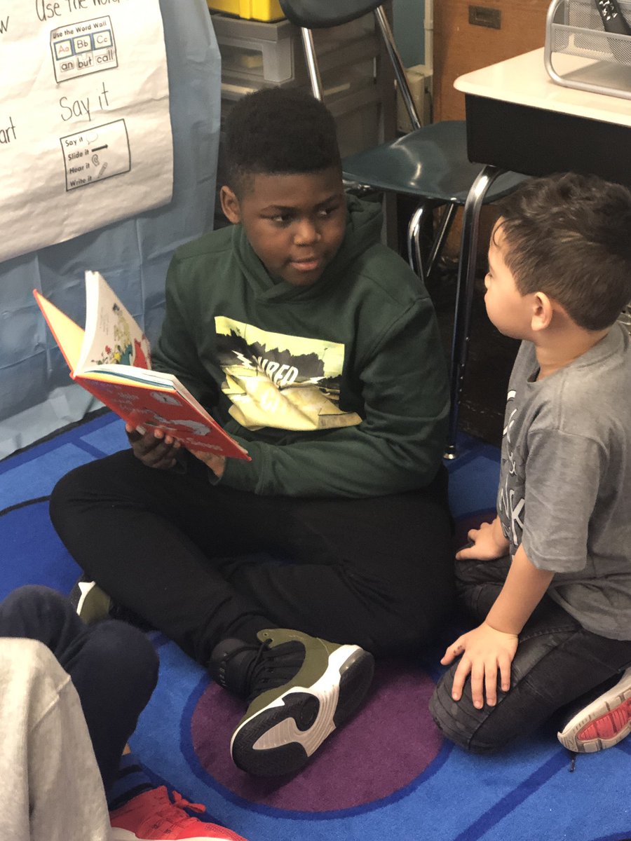 PrincipalNealy's tweet photo. Seniors reading to first graders. #priceless #givingback #responsibilityrocks https://t.co/gF1S1LEoyB