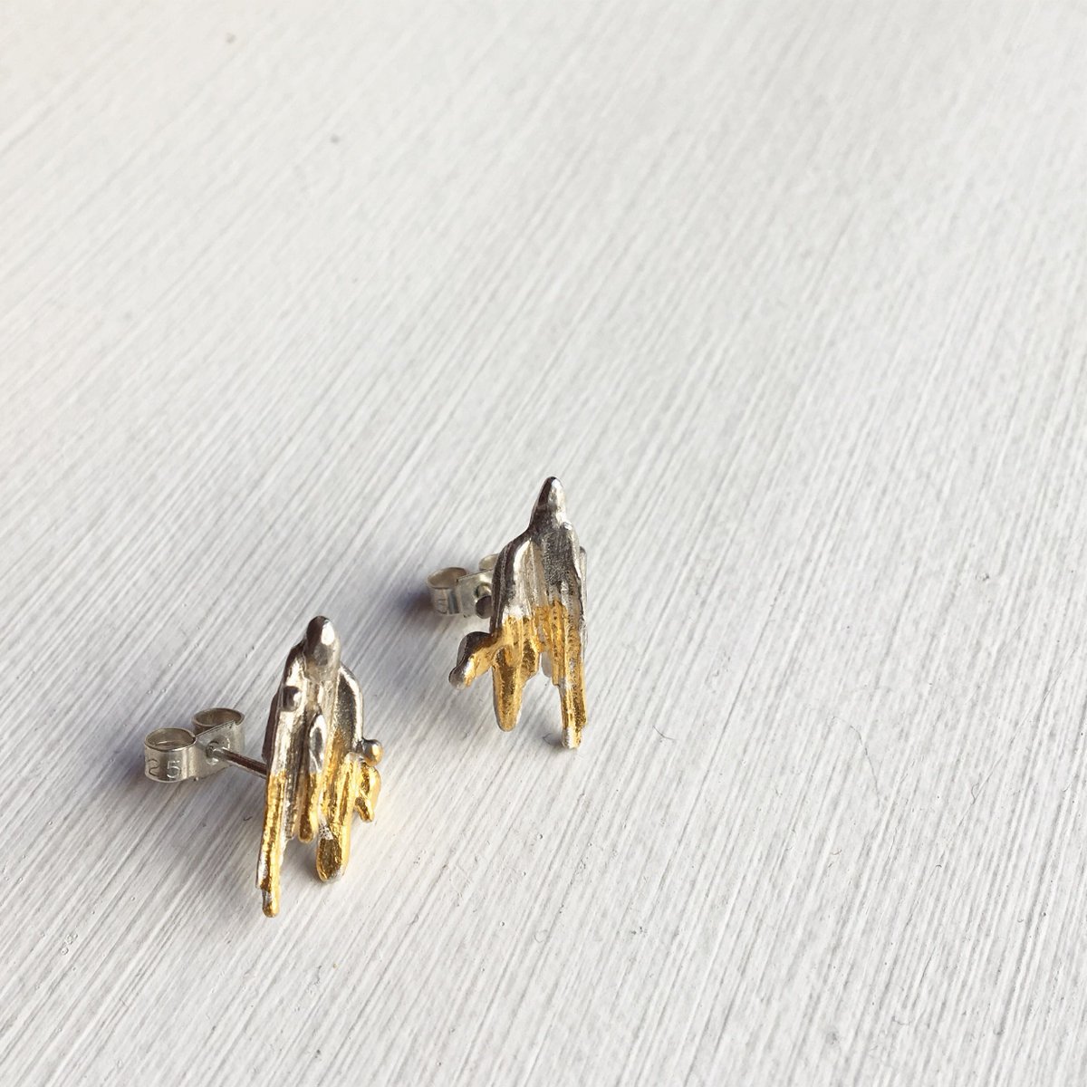 Our 'Object of the Week' is a pair of ‘Molten Leaf’ Earrings by Laura Ngyou (<a href="/Laurangyou/">Laura Ngyou</a>). Studs, sterling silver and 24ct gold, height 18mm x width 10mm x depth 3mm. Find our more and buy online on our website: buff.ly/2HnmWml