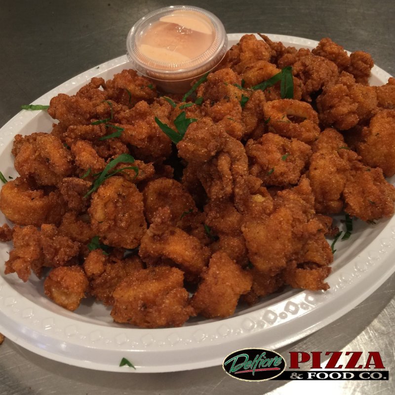 DelfiorePizza's tweet photo. Our tasty #FriedCalamari has a flavorful crunch you'll love, especially when you add our special sauce! Who wants a bite? 😋 #MenuSpotlight https://t.co/uVpUMOZ5gL