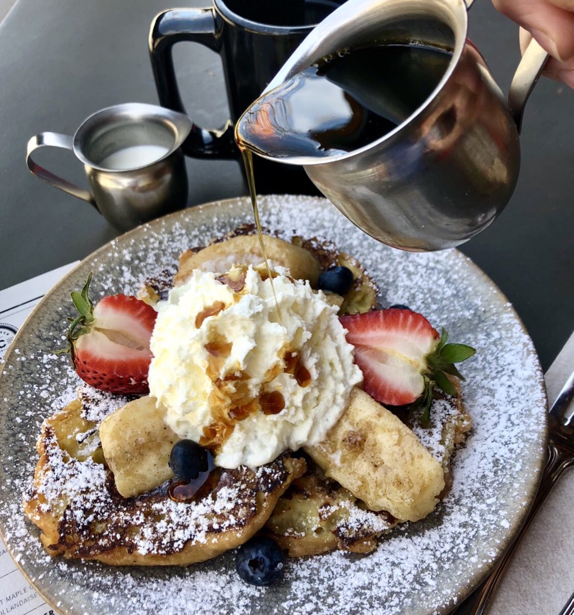 plancheck's tweet photo. Donuts &amp; French Toast wrapped into one?! Who’s in?? Our Cruller Donut French Toast on special today at all #PlanCheck locations for #NationalFrenchToastday. French toast made out of our classic cruller donuts with caramelized banana, fruit, cinnamon, whipped cream &amp; maple syrup. https://t.co/pxYmrKsjxG