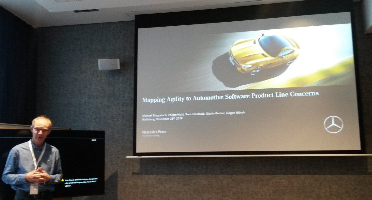 M_Ciolkowski's tweet photo. Michael Stupperich from Daimler at #profes18 #quasd18: How can #agility be combined with automotive product lines? Software components are reused across cars and hardware.  How to gain speed from agility  without losing #reusability (needs planning &amp; compliance)? @PROFES_conf https://t.co/kiGg1BT7Ka