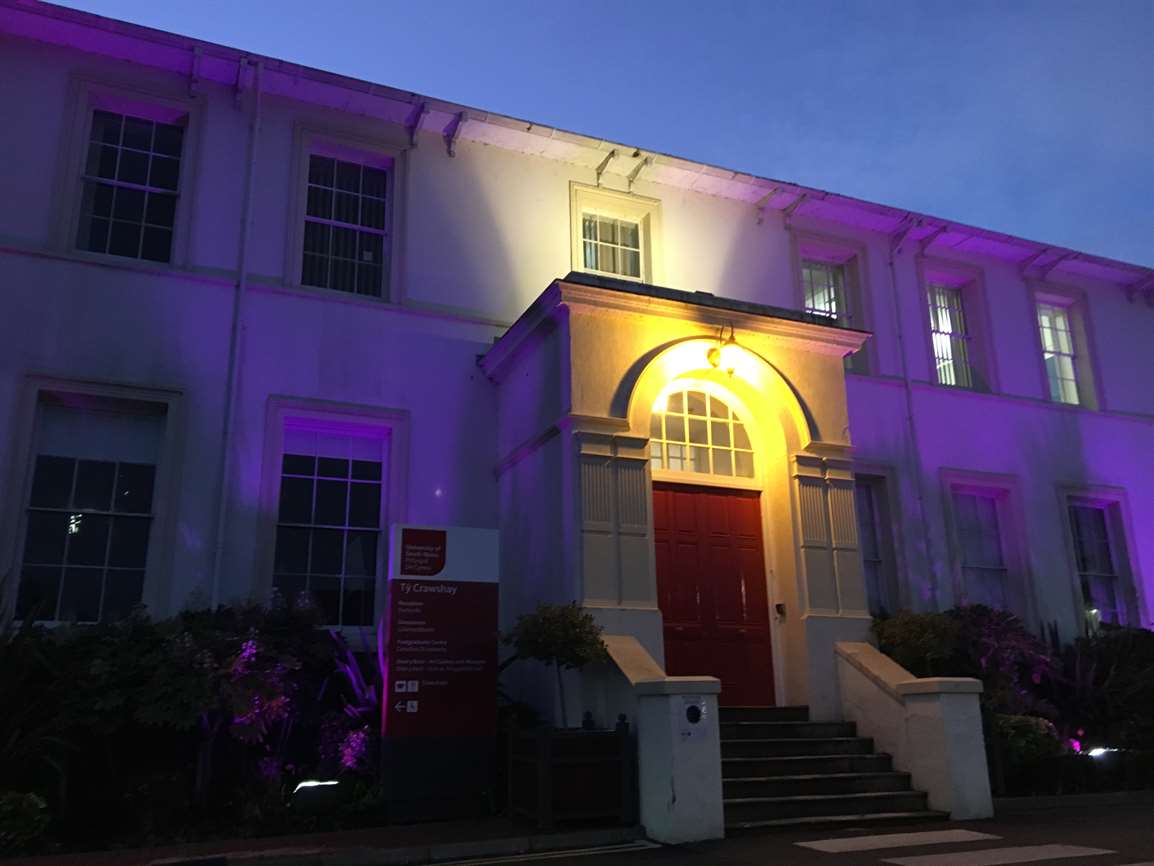 USWEquality's tweet photo. On #IDDP2017 USW lit up Ty Crawshays in purple to demonstrate our commitment to #disabilityinclusion. This year we will be lighting up three buildings! We are also hosting a disability equality & inclusion seminar, all welcome: https://t.co/B8c5v7djwy #PurpleLightUp #IDDP2018 https://t.co/bqLF43Ey9t