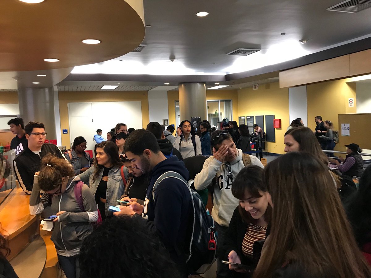 Students waiting for their orders at the Starbucks in FIU library.