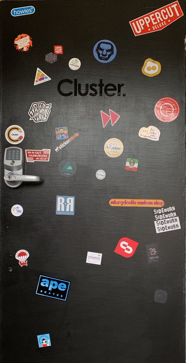 stroudcluster's tweet image. Project &quot;cover the door with stickers&quot; is progressing nicely. Thanks to Julie @PacWorkplaces in the USA and Jenny from Büro Lokal in Switzerland for the recent additions! Please send us your stickers #coworkingspace #clustercommunity  - see stroudcluster.com/news/2018/10/4…