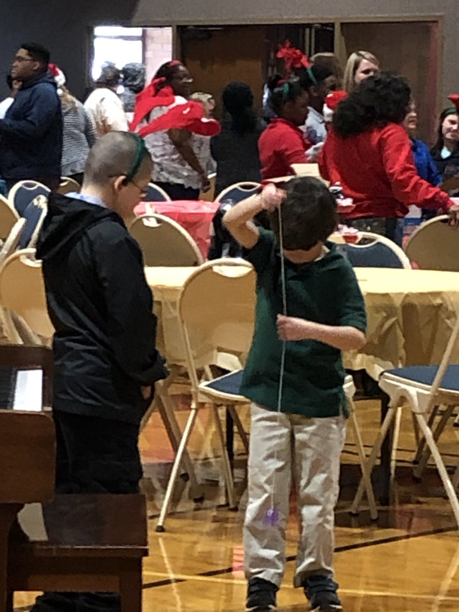 Photo of the Day: a boy shows new yo-yo to his antlered friend. #watchthis #ChristmasLightsProgram #specialneeds