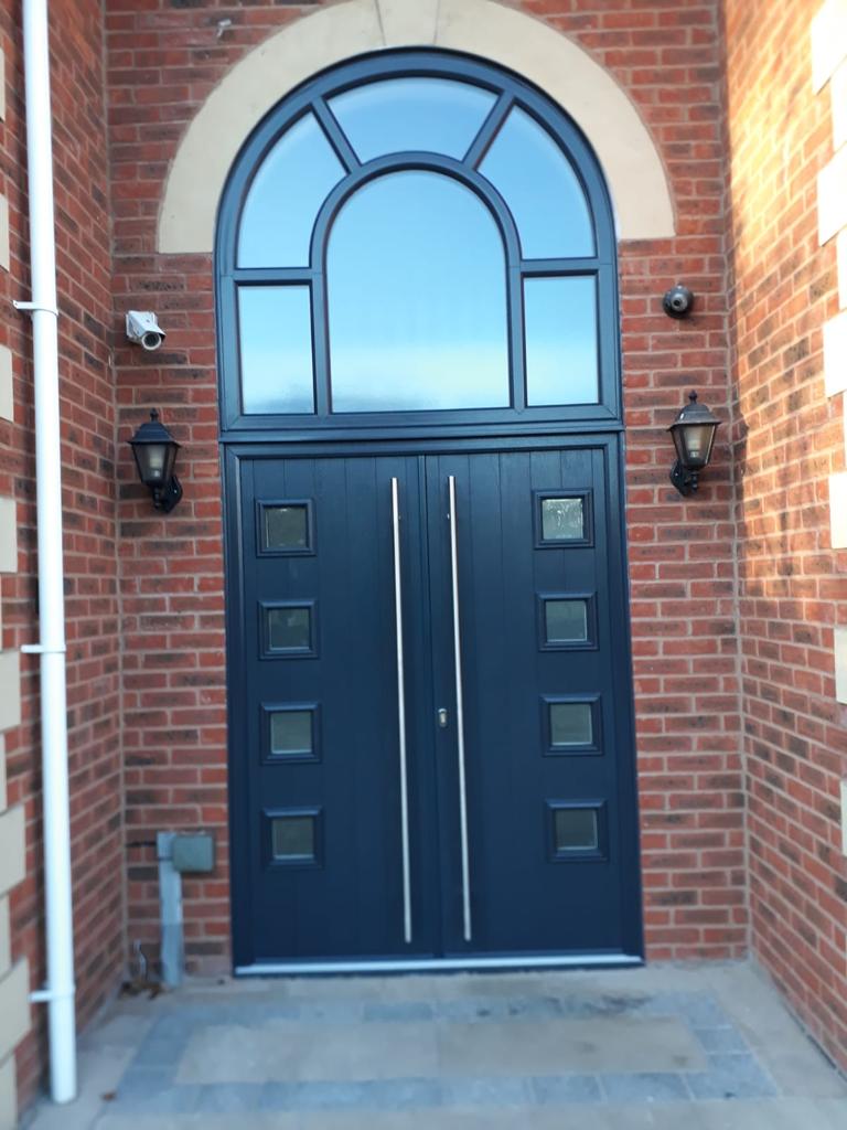 Windoworld's tweet photo. Brand New fitting! RAL7016 Anthracite Grey double Composite Doors with a huge arched window fitted by one of our fantastic teams, pictured here in action! Give us a call on 01257 367 899 for Chorley &amp; surrounding or 0151 531 0056 for Liverpool &amp; surrounding for your free quote! https://t.co/RAqZTZfoIb