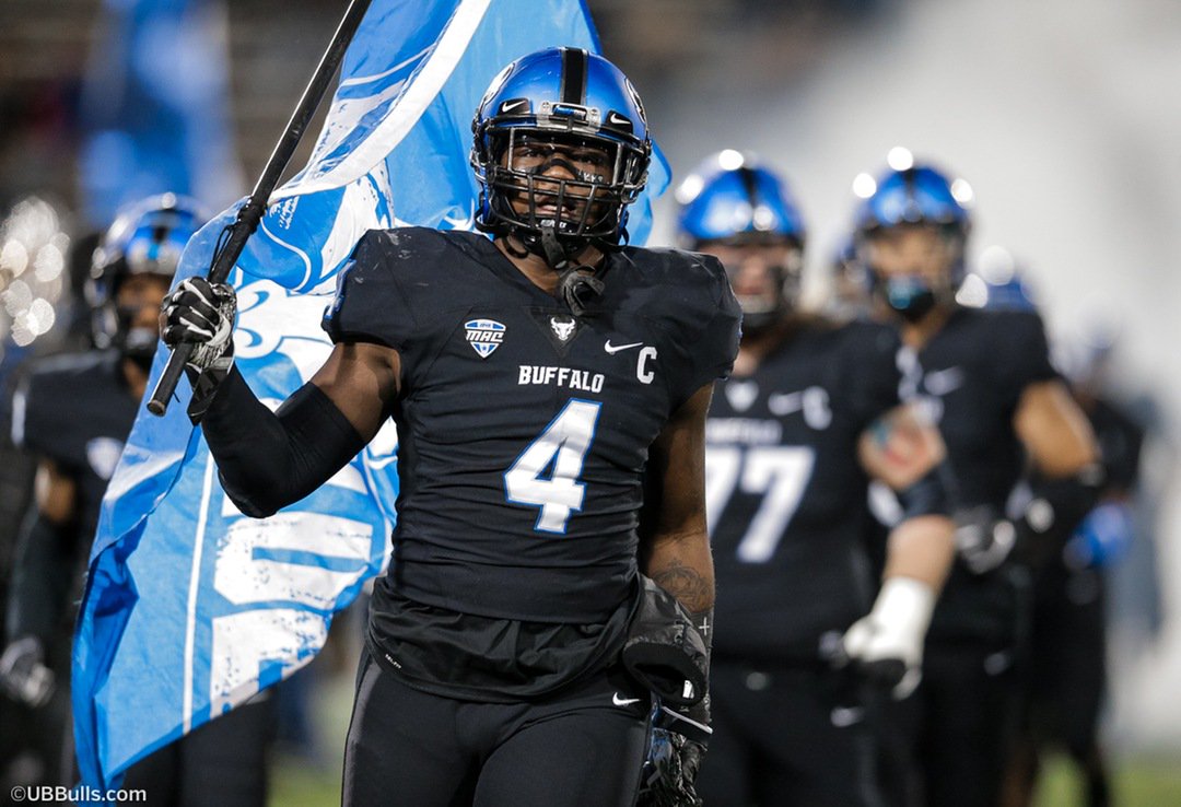 Khalil Hodge holding UB True Blue flag