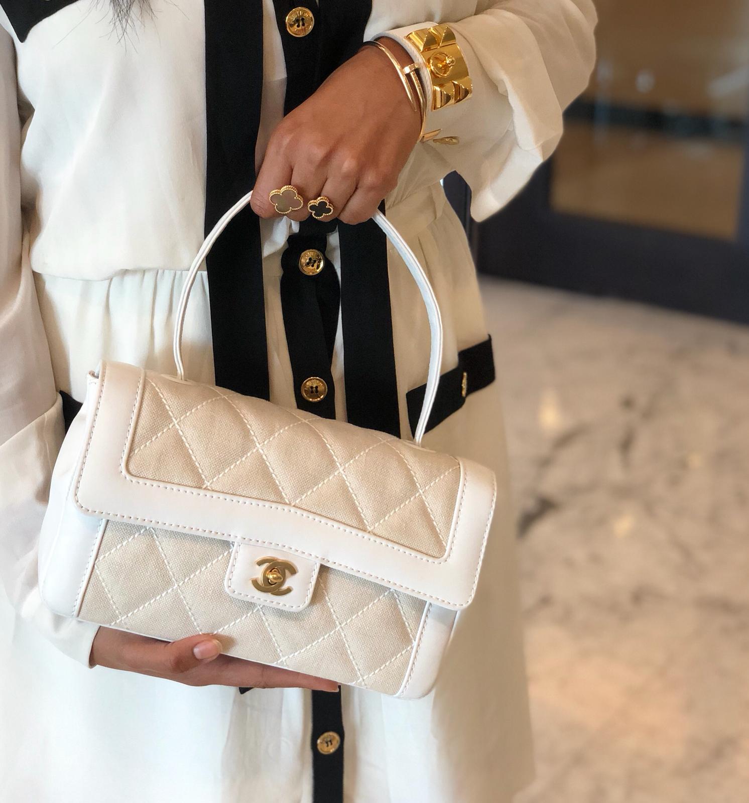 Luxury Promise on X:  Dress impeccably and they remember the woman - Coco  Chanel Shop this stunning vintage Chanel classic canvas top handle flap bag  now at Luxury Promise.  /