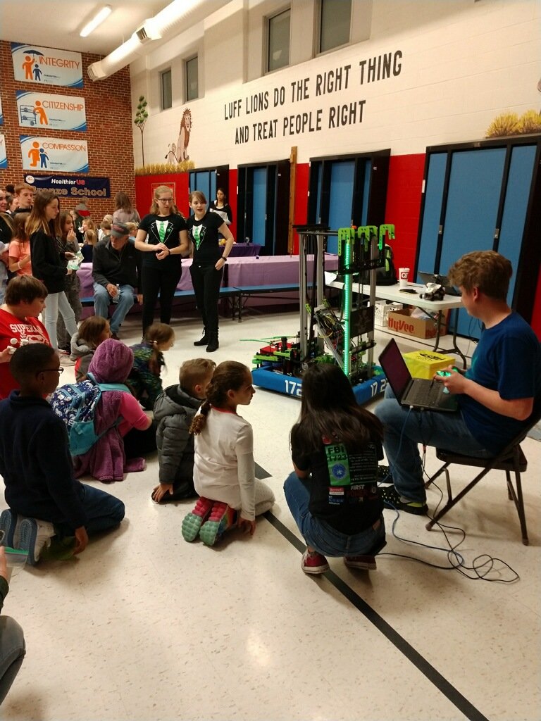 frc1723's tweet photo. FBI showing off Melman, our 2018 robot, to the kids at Luff Elementary STEM Night! They're playing catch! #1723ISWATCHING @ISDAcademies #isdstrong https://t.co/WSoP5HhF0p