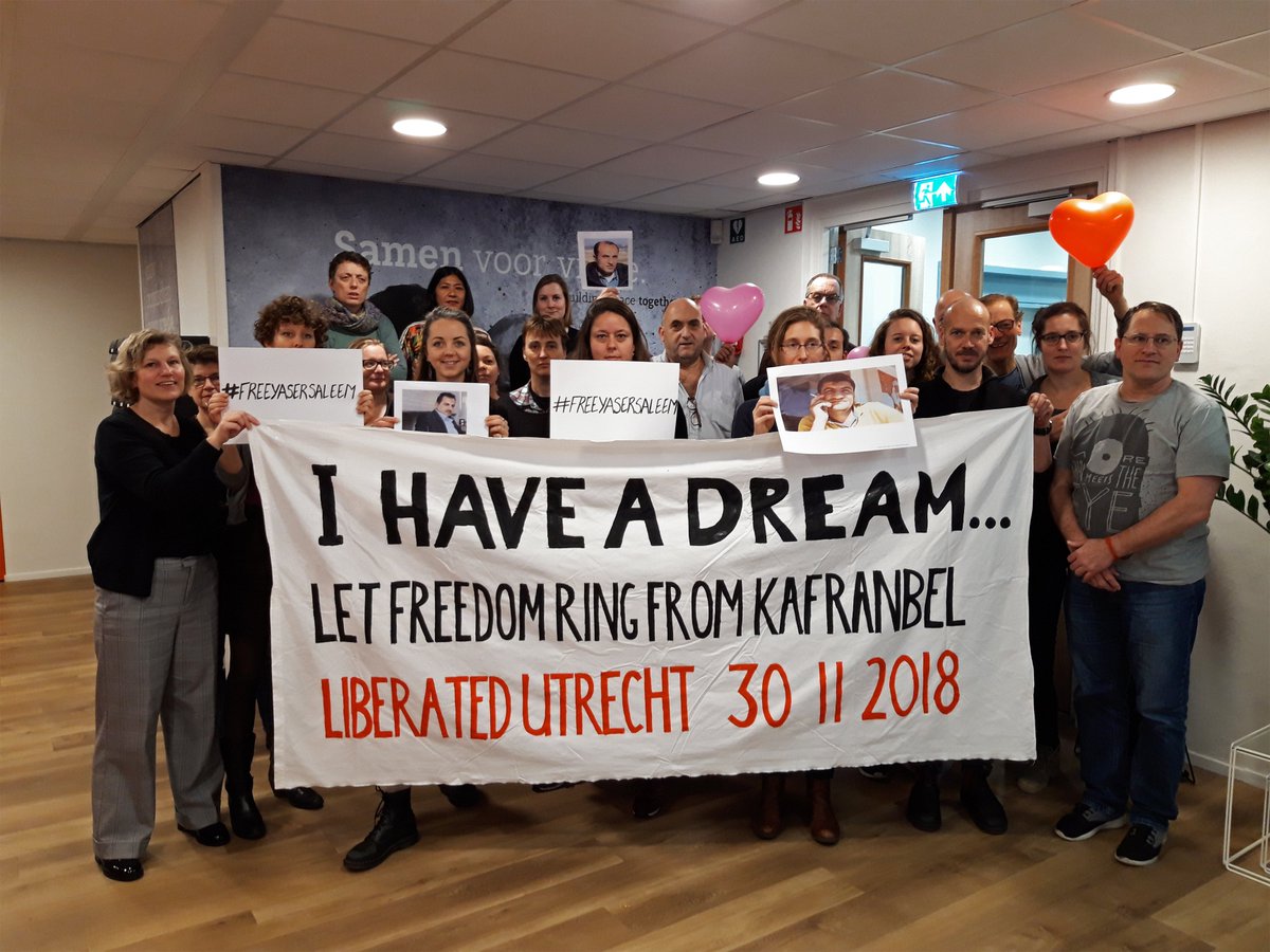 PAXforpeace's tweet photo. A week ago, Syrian activists Raed Fares and Hamoud Jneid were killed. They were leaders that inspired people to continue their struggle. Today, we show our respect, and stand in solidarity with those who fight for freedom and dignity. https://t.co/EPmiO69Azu