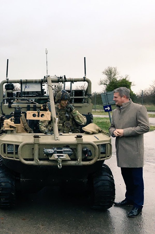 ArmyAEWE's tweet photo. Stuart Andrew MP, UK Minister of Defence Procurement, speaks to the U.S. Army’s Private First Class Meggison of A Co/1-29 Infantry about driving this @HIPPOmultipower ‘optionally manned’ remote control all-terrain military load-carriage vehicle. #AWE18 
@ArmyAEWE
@BritishArmyUSA https://t.co/777HDVbq8l