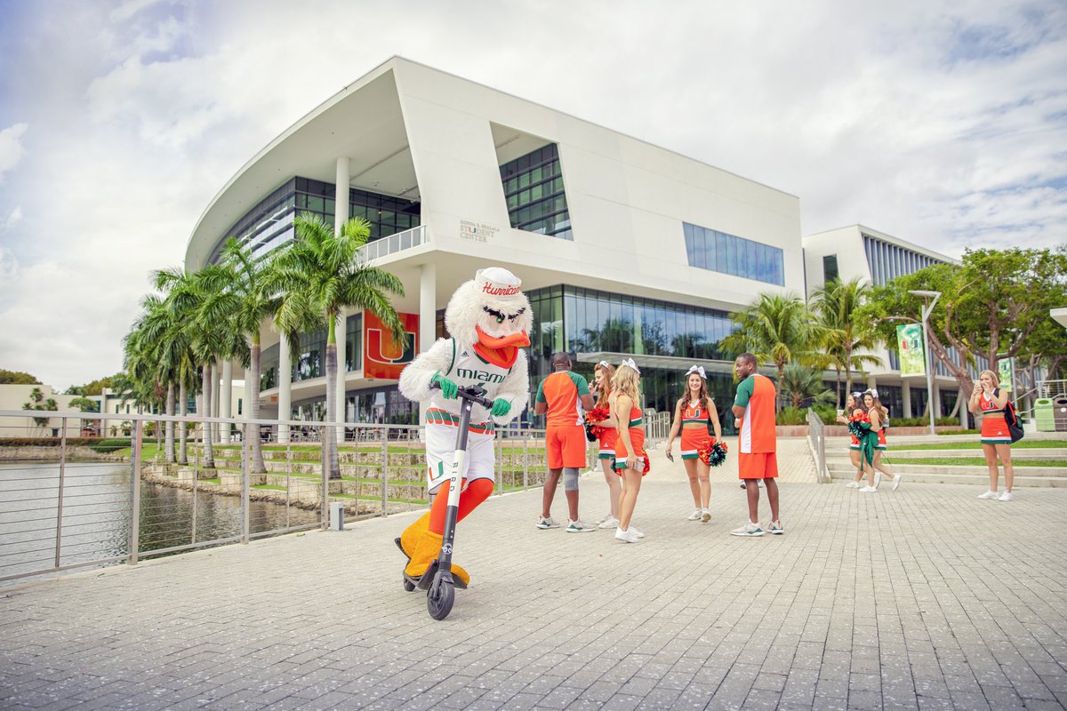 univmiami's tweet photo. Riding into the weekend like...🛴🙌💚 #umiami https://t.co/vHq0lysCQp
