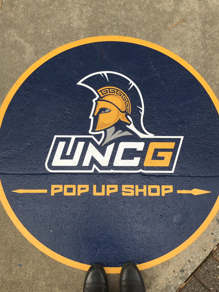 UNCG's tweet photo. The @UNCGBookstore Pop Up Shop in #dgso is open for business! Add our holiday filter to your snaps when you visit today. #UNCGWay #letsgoG @UNCGAlumni @UNCGAdmissions @greensborocity @DowntownGSO https://t.co/Q2QYPf7ABe