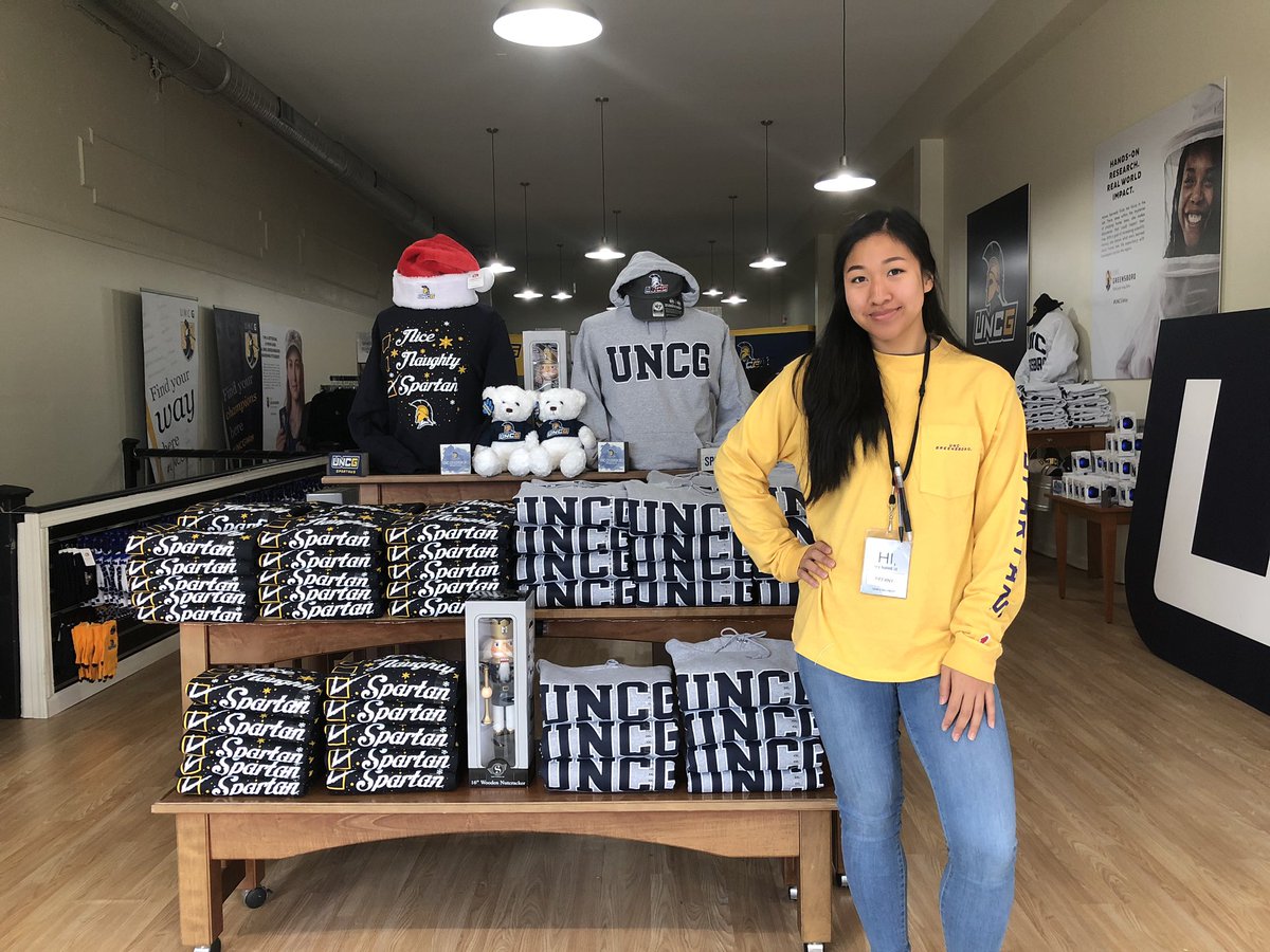 UNCG's tweet photo. The @UNCGBookstore Pop Up Shop in #dgso is open for business! Add our holiday filter to your snaps when you visit today. #UNCGWay #letsgoG @UNCGAlumni @UNCGAdmissions @greensborocity @DowntownGSO https://t.co/Q2QYPf7ABe