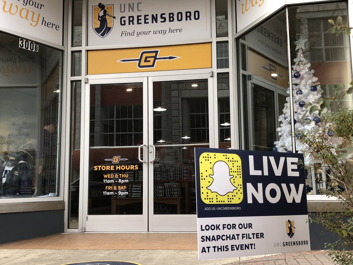 UNCG's tweet photo. The @UNCGBookstore Pop Up Shop in #dgso is open for business! Add our holiday filter to your snaps when you visit today. #UNCGWay #letsgoG @UNCGAlumni @UNCGAdmissions @greensborocity @DowntownGSO https://t.co/Q2QYPf7ABe