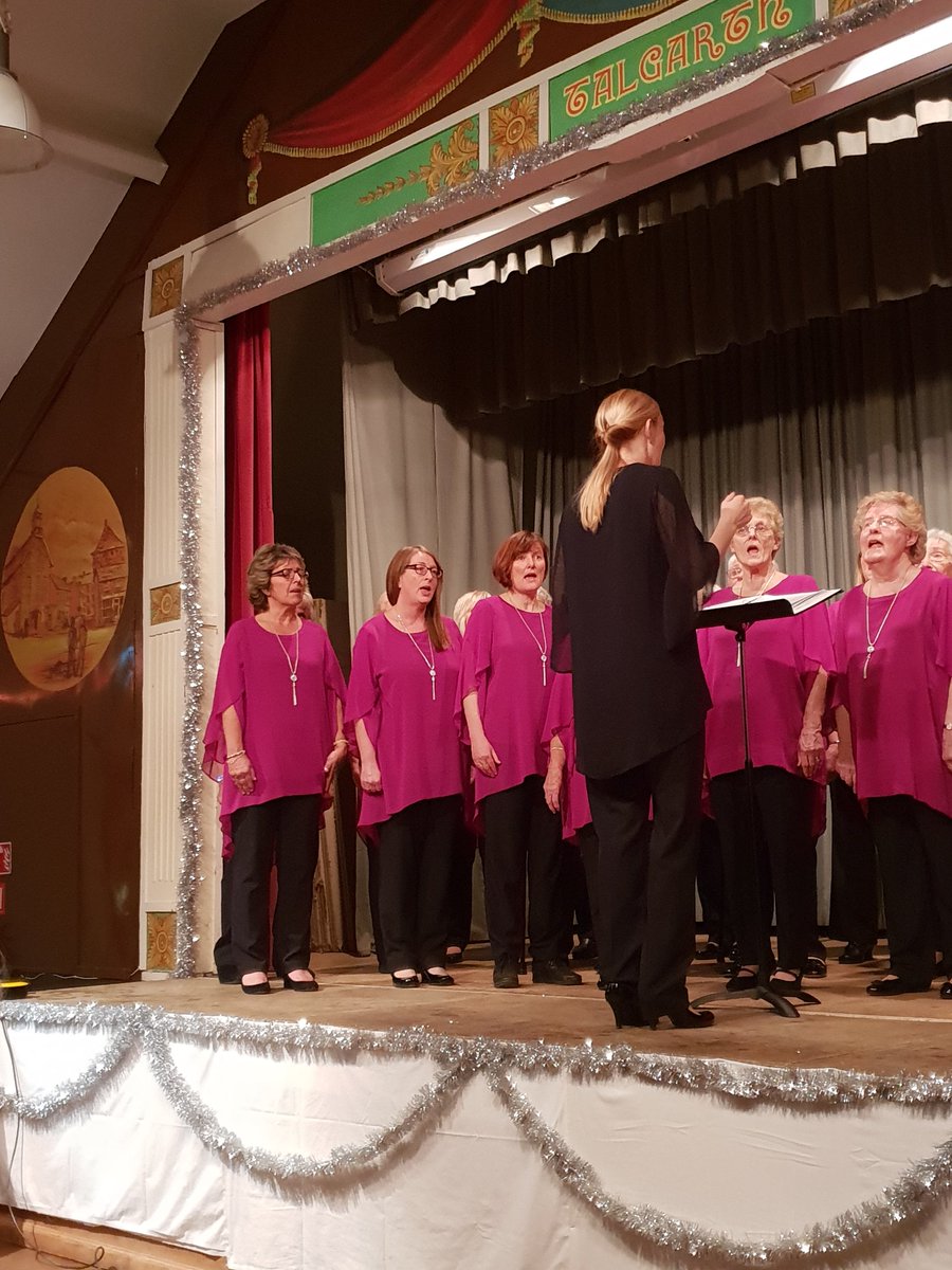 WmPowell2021's tweet photo. .@CaerphillyChoir under their new musical director, Ellie Baker, wowing a packed #Talgarth Town Hall for tonight's @RABIcymru_wales #ChristmasConcert 🎅 https://t.co/wUBdPjj5gr