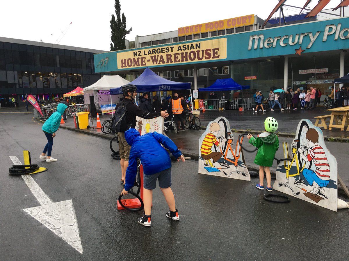 BikeAKL's tweet photo. Gathering at the #lightpathfest despite the odd drop of rain - Aucklanders are awesome and unmeltable! https://t.co/fIK1hhUJPX