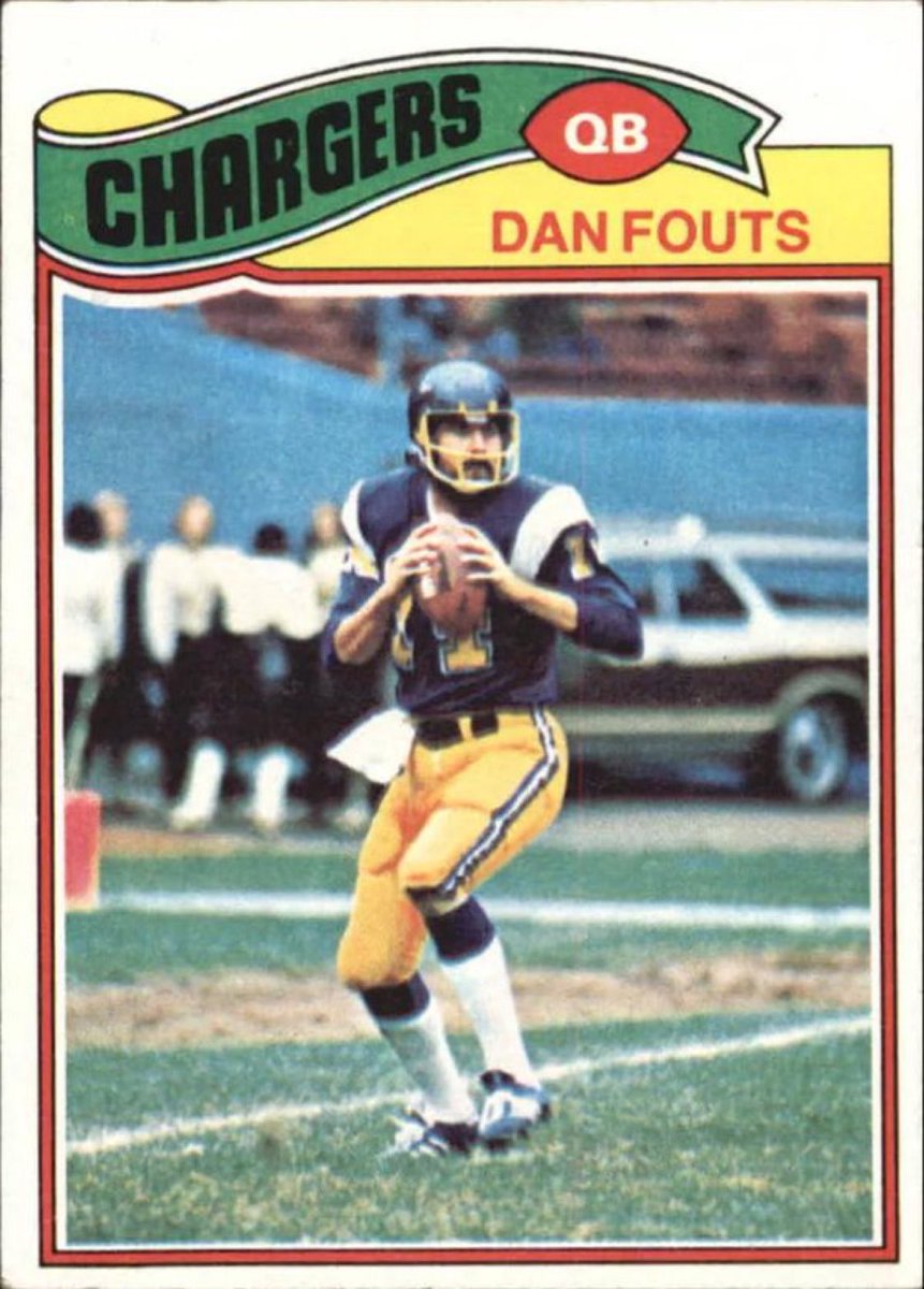 Dan Fouts drops back to pass as a confused Clark Griswold asks for directions on the Chargers sideline.