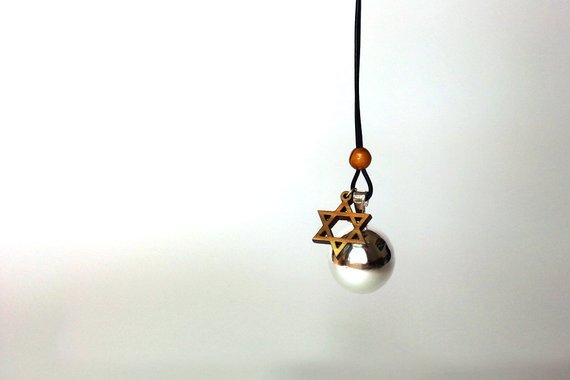 knooopMe's tweet photo. Embody the spirit of Judaism with this harmony bell maternity necklace from The Charmer Charms. Custom handmade in painstaking detail, it features a silver-plated bola charm suspended from a length of leather cord. https://t.co/t2P8HHkOeC #handmade #necklace #jewelry https://t.co/ub7xGTrDDE