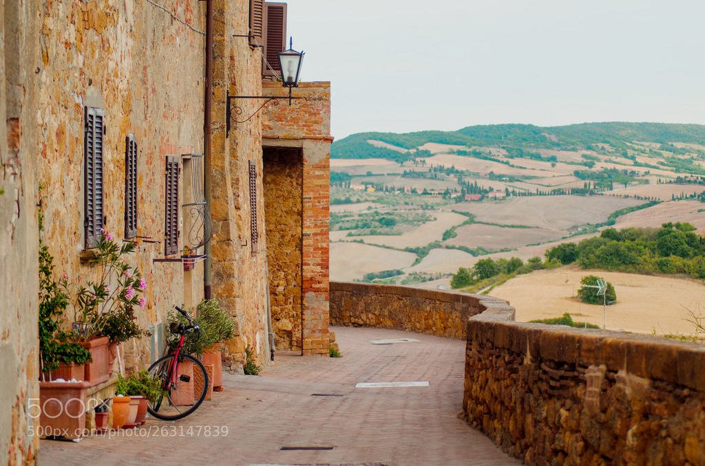 Penza street with view on hills (автор фото KatSpi) #bicycle,window,pienza. door,street,old,italy,italian,wall,stone,european,house,home,medieval,europe,city,urban,tuscany,architecture,facade,door,antique,italia,flower,rustic,wooden,travel,beautiful,road,picturesque,painting