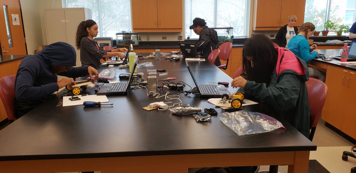 sallyky's tweet photo. Hard at work assembling their robots! @chicktechrdu @NetAppWIT #girlsruletech #ctrdu18 https://t.co/okDaCTgS5H