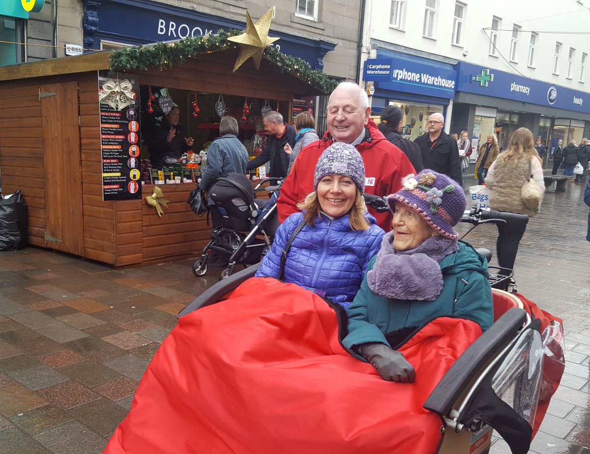 CWAPerth's tweet image. Out enjoying Perth Christmas market with the help of Cycling Without Age volunteer pilots.