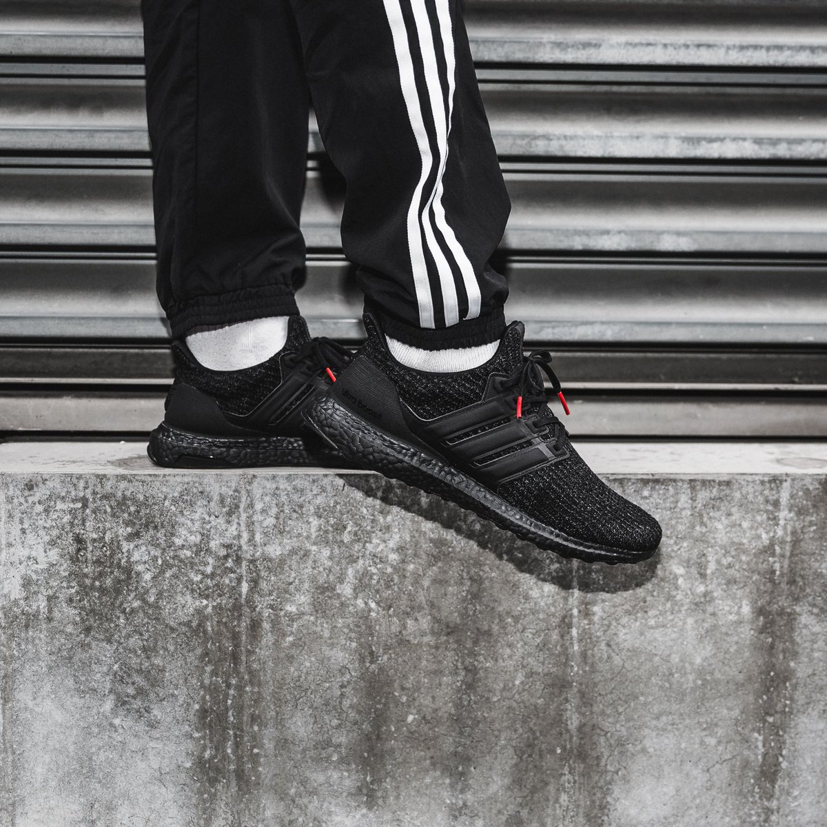 ultra boost triple black active red