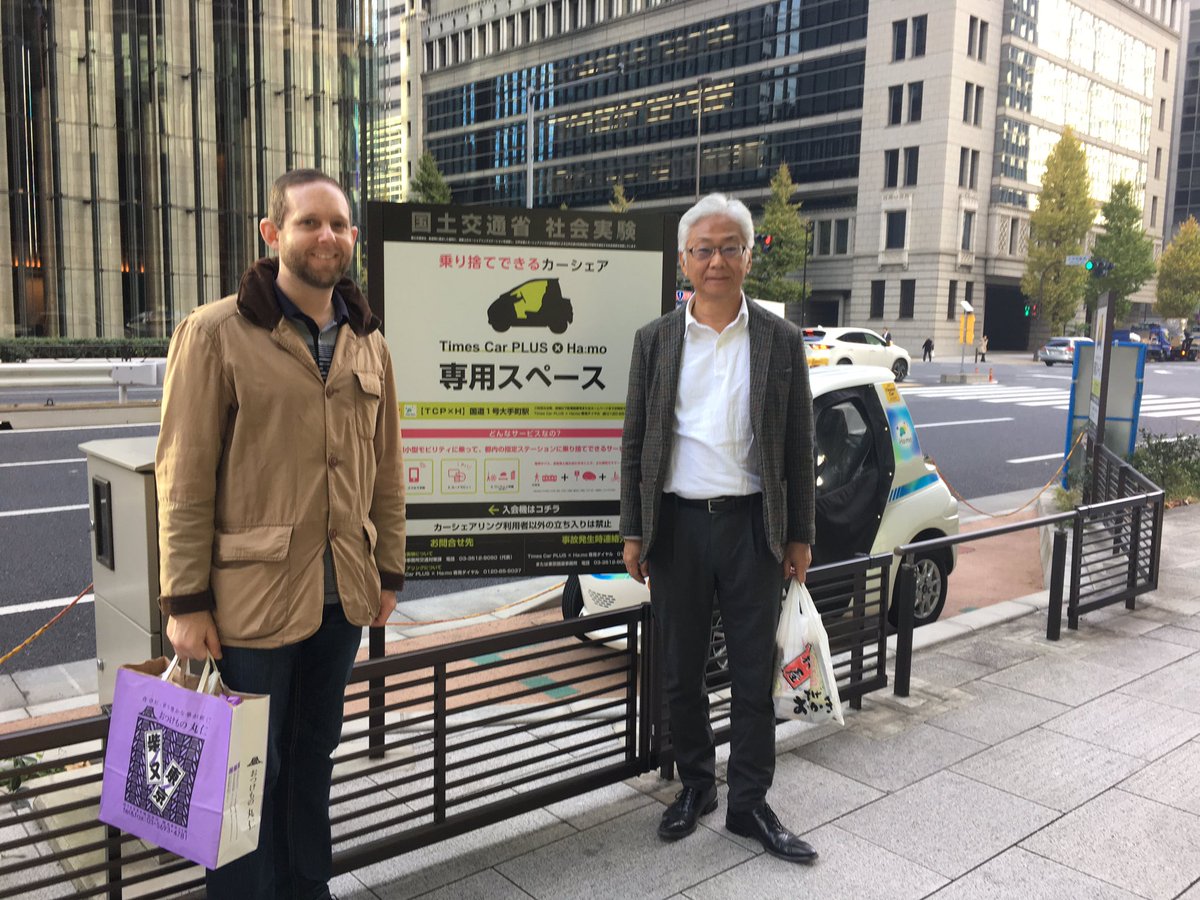 scottericlevine's tweet photo. At central Tokyo’s @TCP_hamo w/Prof Shoshi Mizokami...learned this pilot (1-seater EVs) is *very* rare instance in Japan of #SharedCars w/on-street parking. Didn’t take it for a spin though! https://t.co/ZNTXPUsYyG