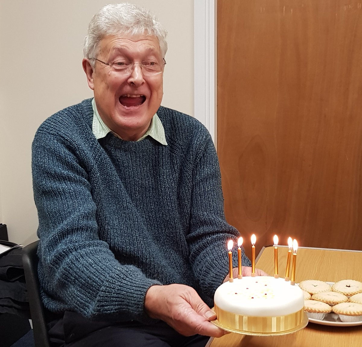 AbbotsCommunity's tweet image. Richard Kennell, Chair of Abbots Langley Community Centre, enjoys the Centre's 50th anniversary celebration cake, complete with golden candles. Happy anniversary @AbbotsCommunity! Serving the village and its neighbourhood since 1968.