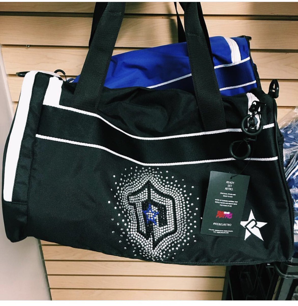 There’s even more beautiful <a href="/RebelAthletic/">wcss 2008 dance</a> gear now available in the Cheer shop! Pick up this super cute duffle bag in blue or black! 💙🖤